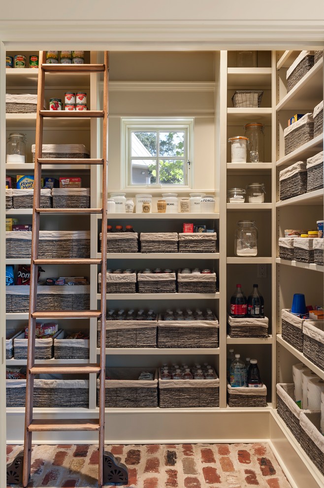 kitchen pantry with open cabinets and organization baskets
