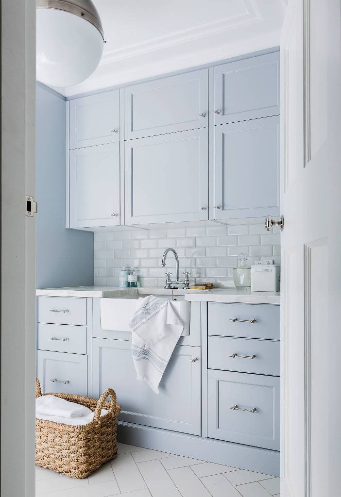 Blue Laundry Room Cabinets with White Subway Tiles