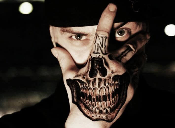 Skull Tattoo On Hand Over Face