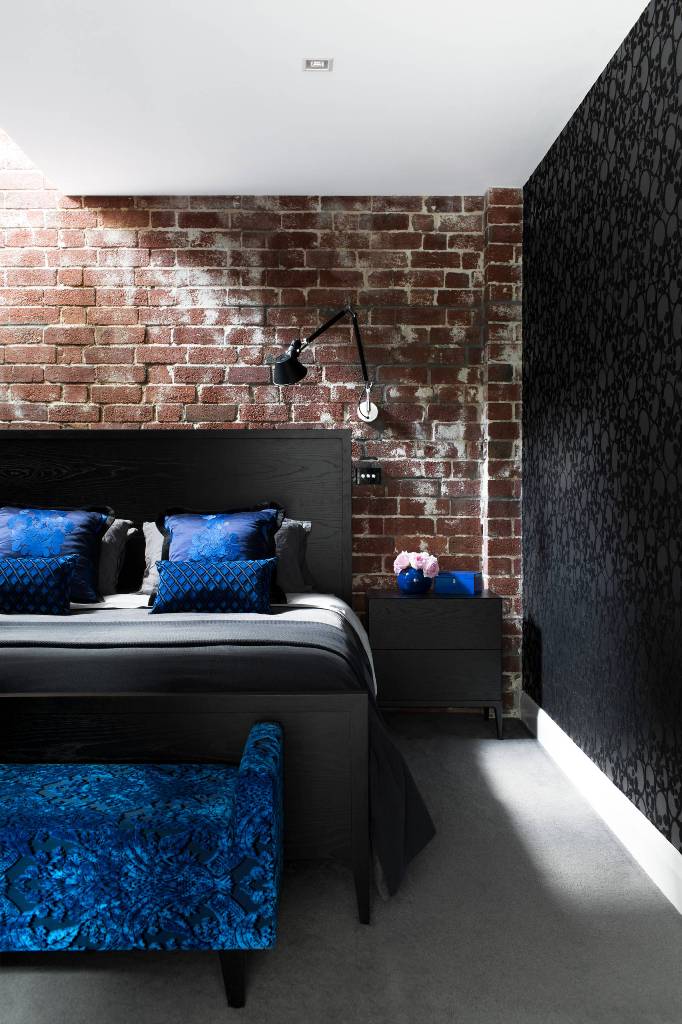 Contrast of Brick Walls, Black Bed With Electric Blue