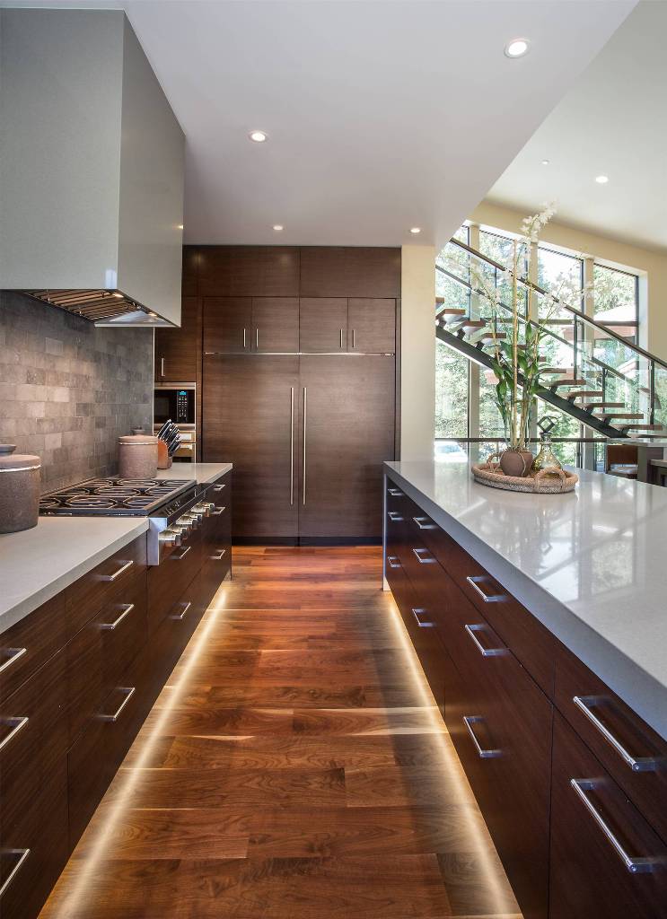 Modern Kitchen With Walnut Cabinets And Quartz Counter Top