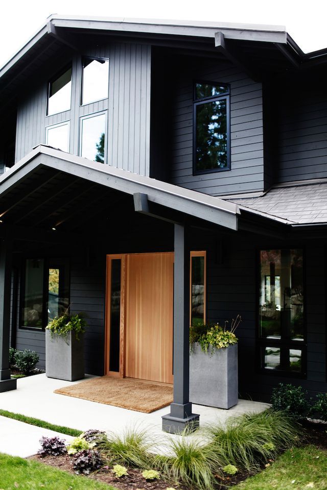 Black House with Wooden Brown Door