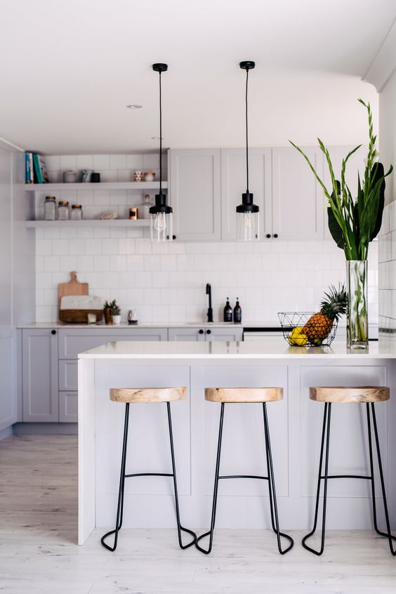Minimalist White Kitchen With Stools And Lamps