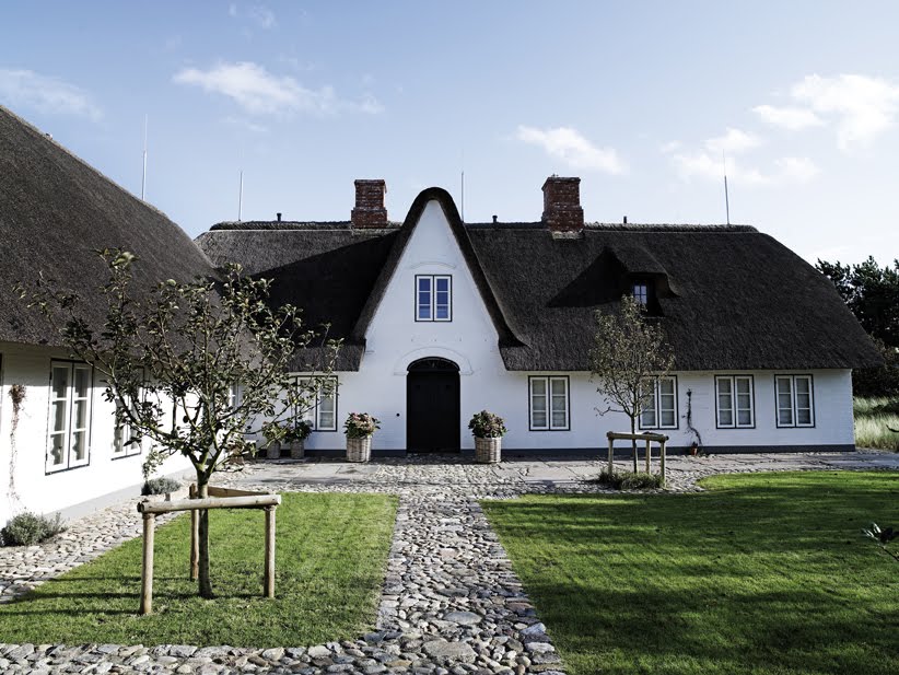 White House with Black Traditional Thatched Roof
