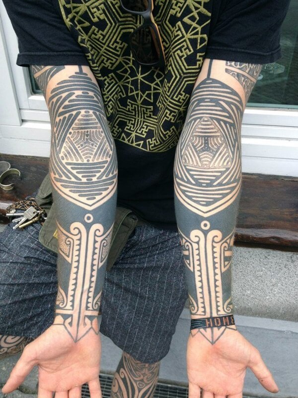 Elaborate Overlapping Lines and Negative Space Tattoo