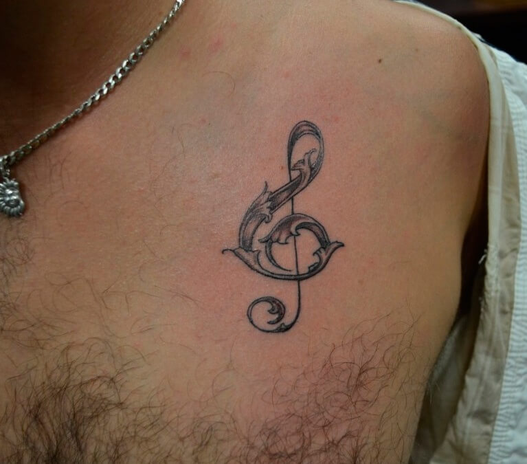 Infinity Music Tattoo Above Chest For Men