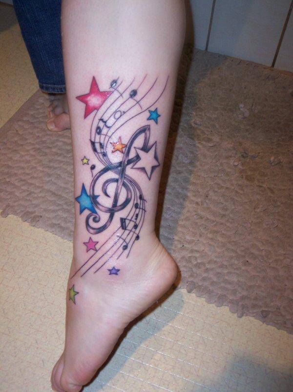 Stars And Music Tattoo On Foot