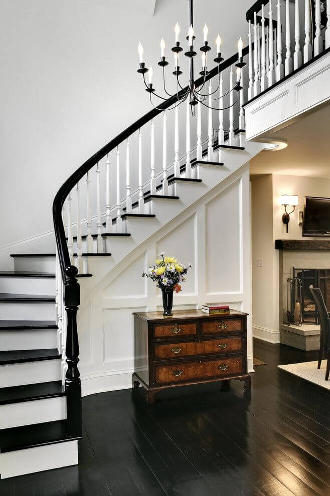 Traditional Staircase with Black Hardwood Floors