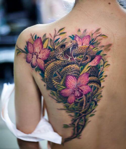 Brightly Colored flowers Snake Tattoo Females Back