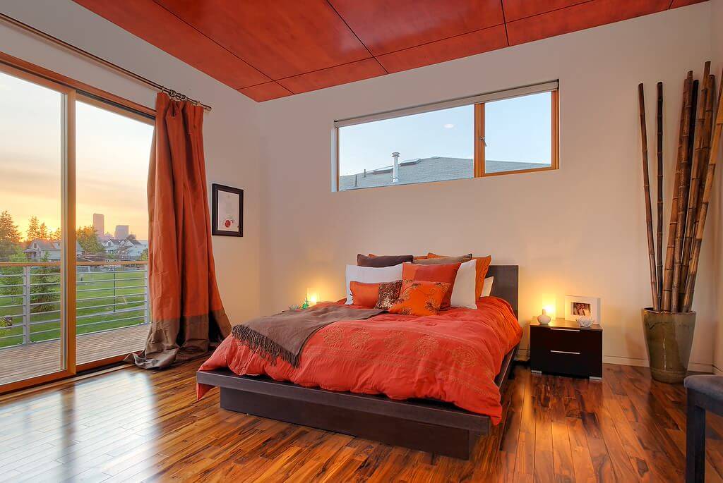 Solid Orange Curtains Minimalist Medium Tone Wood Floor Modern Bedroom