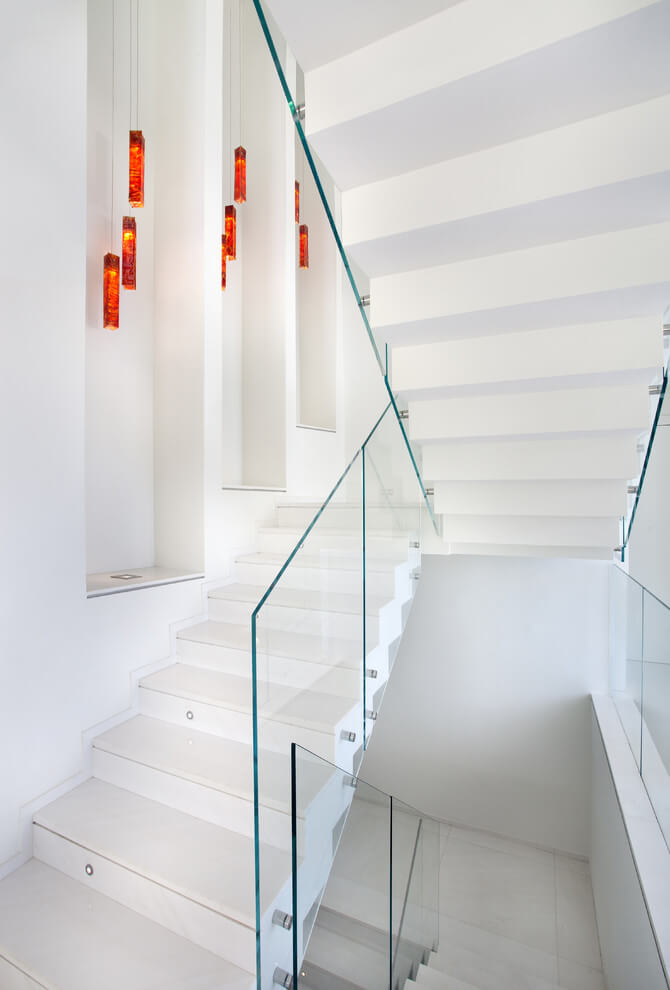 White Stairway Wall Niches with Hanging Lights