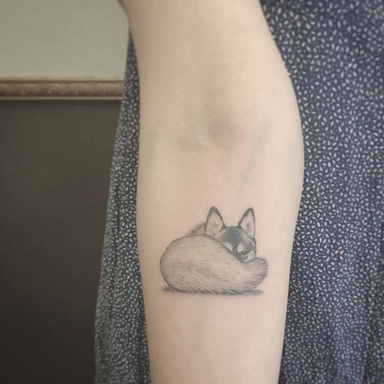 Tiny Wolf Tattoo