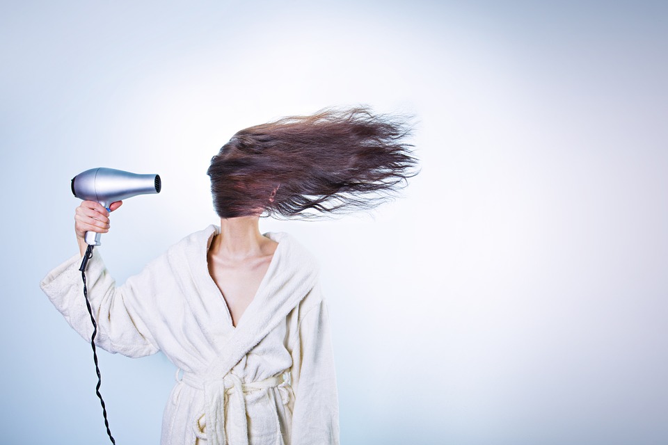 woman hair drying
