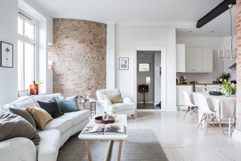 A Bright Interior Design Apartment With One Round Brick Wall